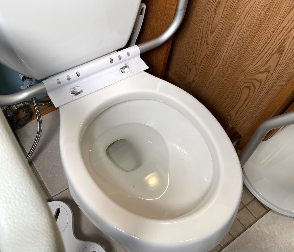Place toilet safety rails on toilet first