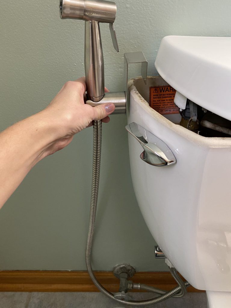 Handheld bidet sprayer attach holder to toilet tank