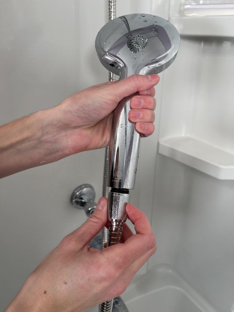 how to attach a hand held shower head holder to the hose