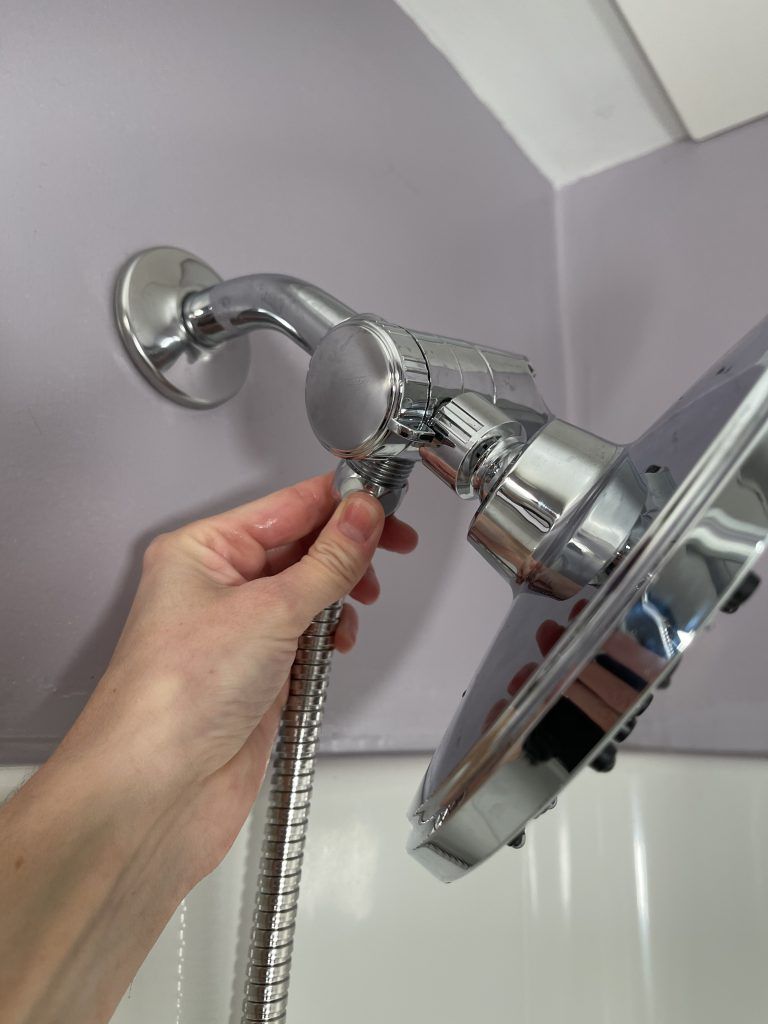 how to attach the hose to the valve for the hand held shower head