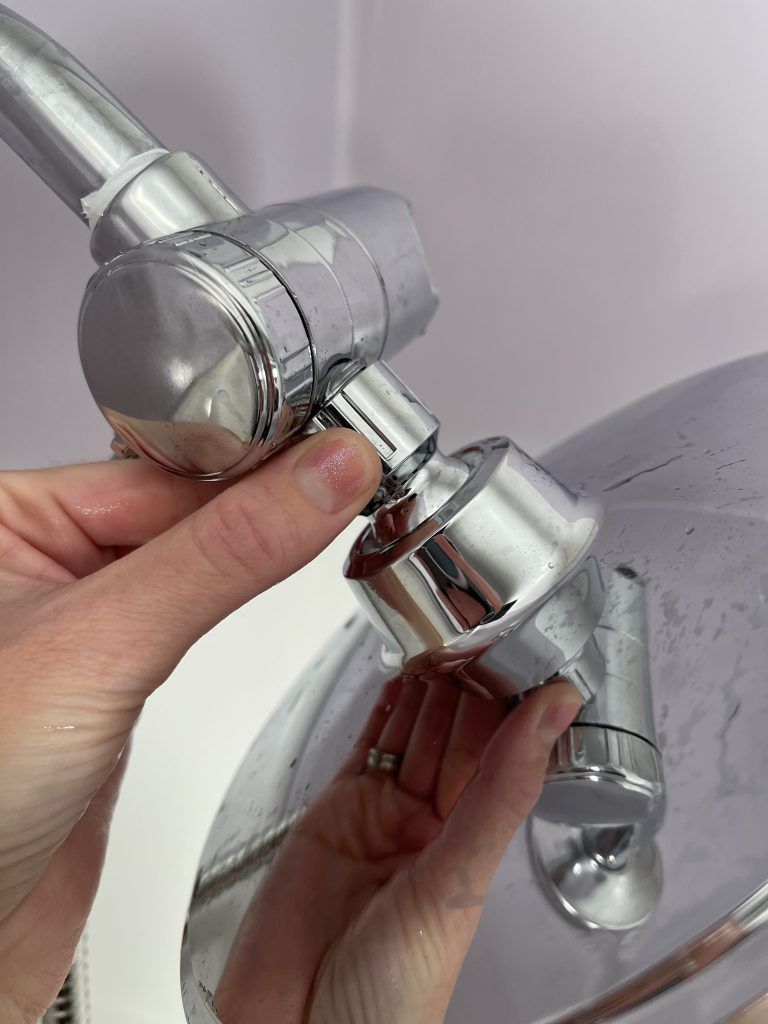 how to attach the static head of the hand held shower head to the valve