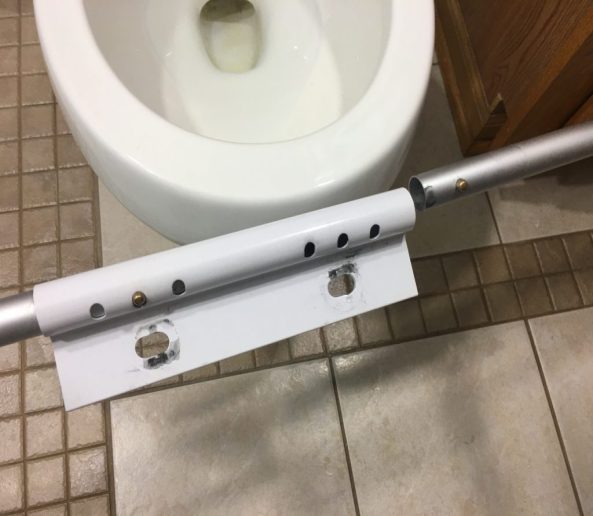 Attach toilet safety rails to mounting bracket