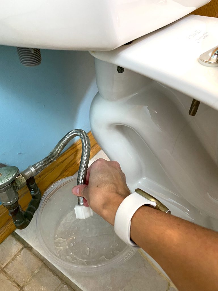 Install bidet - Hold water line over bucket Install Bidet - Hold water line over bucket