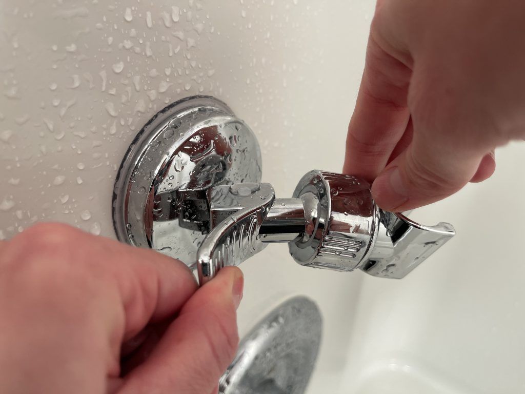 how to install a hand held shower head holder