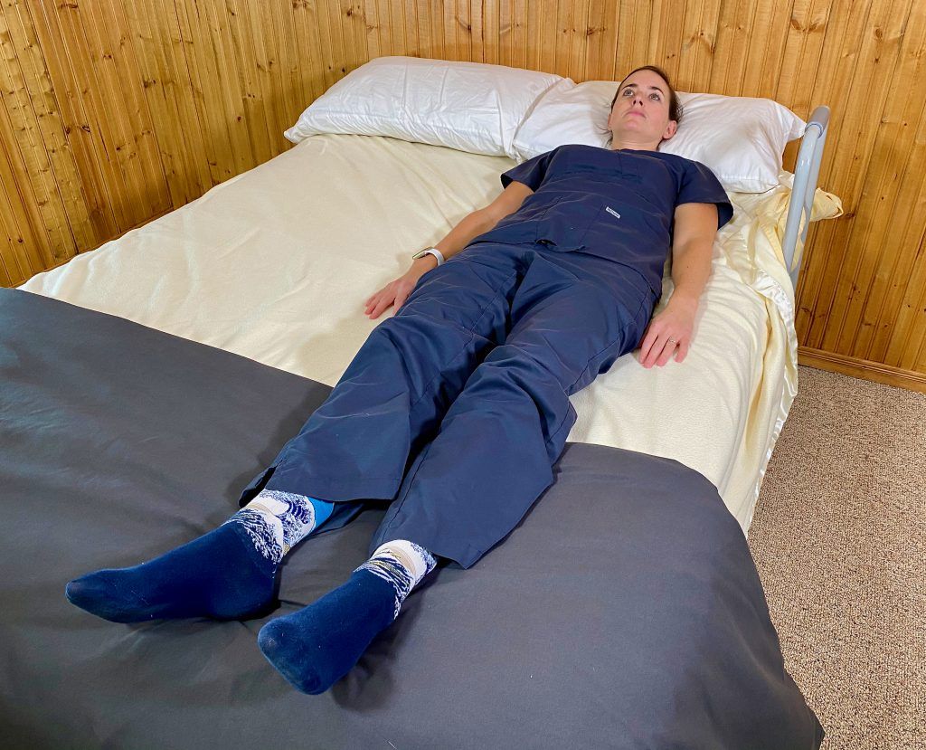 Lay flat in bed - log roll technique